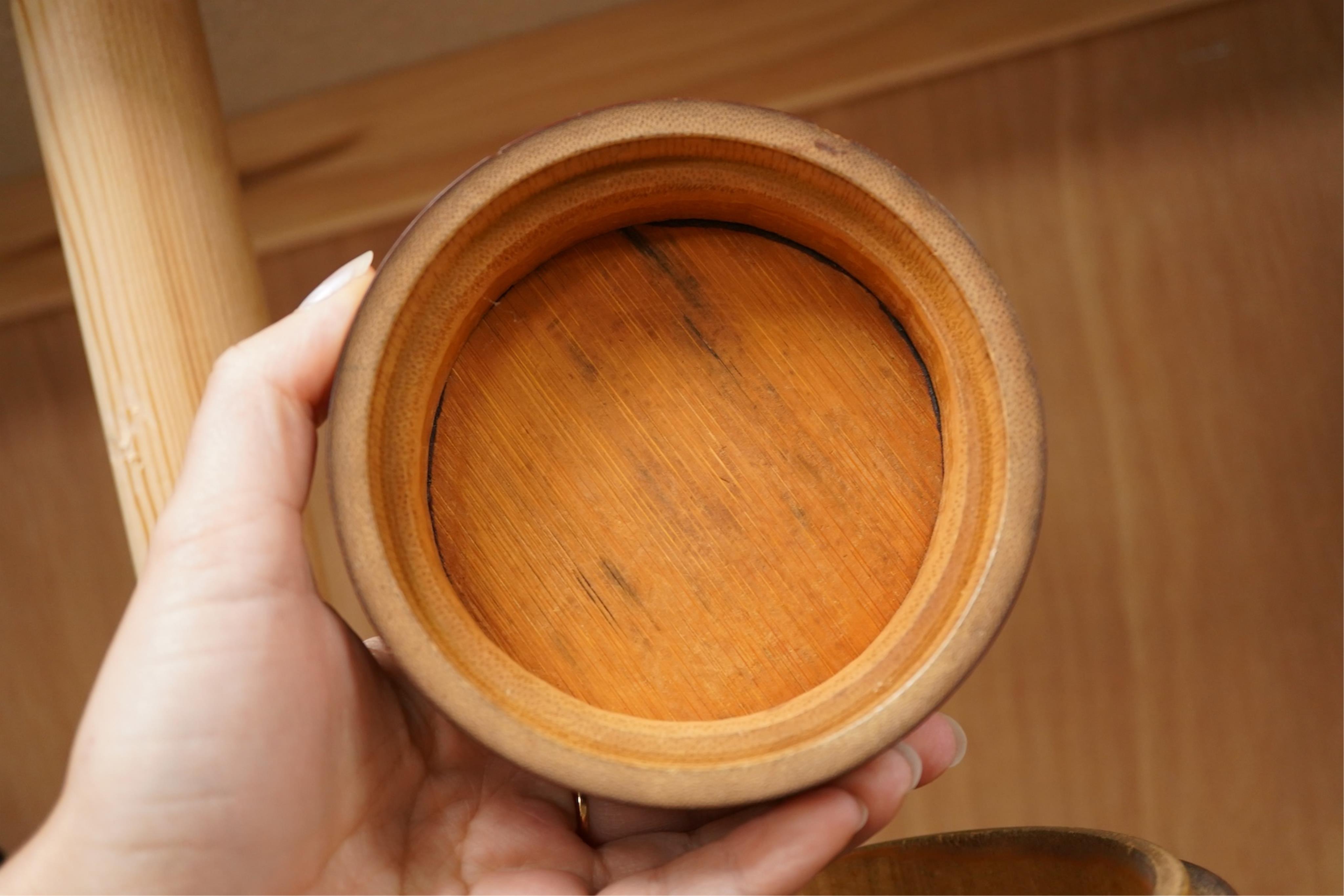 A Chinese carved bamboo tobacco jar and cover, 15cm high